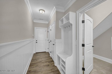 Exceptional curb appeal defines this beautifully designed on Cape Fear National At Brunswick Forest in North Carolina - for sale on GolfHomes.com, golf home, golf lot