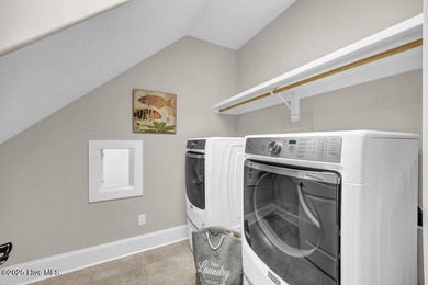 Exceptional curb appeal defines this beautifully designed on Cape Fear National At Brunswick Forest in North Carolina - for sale on GolfHomes.com, golf home, golf lot