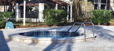 Beautiful end unit condo, located on tranquil pond with serene on Tarpon Woods Golf Club in Florida - for sale on GolfHomes.com, golf home, golf lot