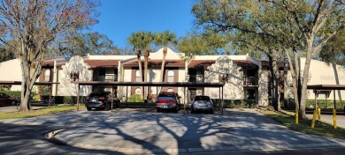Beautiful end unit condo, located on tranquil pond with serene on Tarpon Woods Golf Club in Florida - for sale on GolfHomes.com, golf home, golf lot
