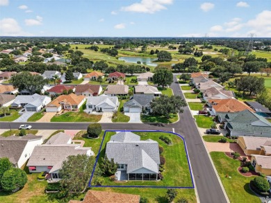 Impeccably manicured home set on a corner lot the The Villages on Nancy Lopez Legacy Golf and Country Club in Florida - for sale on GolfHomes.com, golf home, golf lot