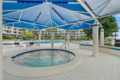 This beautifully updated 2-bedroom plus den residence in the on Isla Del Sol Yacht and Country Club in Florida - for sale on GolfHomes.com, golf home, golf lot