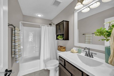 Exceptional curb appeal defines this beautifully designed on Cape Fear National At Brunswick Forest in North Carolina - for sale on GolfHomes.com, golf home, golf lot