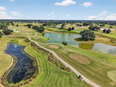 Impeccably manicured home set on a corner lot the The Villages on Nancy Lopez Legacy Golf and Country Club in Florida - for sale on GolfHomes.com, golf home, golf lot