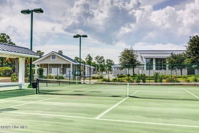 Exceptional curb appeal defines this beautifully designed on Cape Fear National At Brunswick Forest in North Carolina - for sale on GolfHomes.com, golf home, golf lot