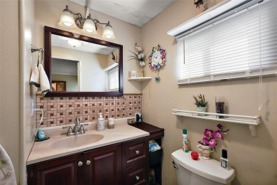 Nestled in the sought after 55+ community of Imperial Terrace on Bay Tree Golf Course in Florida - for sale on GolfHomes.com, golf home, golf lot