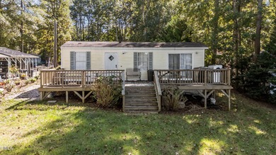 THE ULTIMATE LAKESIDE PLAYGROUND IS WAITING FOR YOU AT LAKE on River Golf and Country Club at Lake Royale in North Carolina - for sale on GolfHomes.com, golf home, golf lot