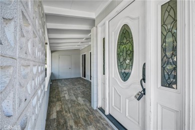 Charming corner end unit in private and peaceful Mutual 3 at on Leisure World Seal Beach Golf Course in California - for sale on GolfHomes.com, golf home, golf lot
