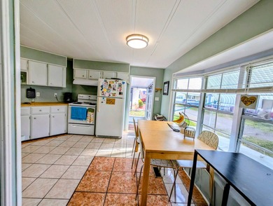 Turnkey Living! Expanded 2BR/2BA in Woodbrook Estates!  This on Grasslands Golf and Country Club in Florida - for sale on GolfHomes.com, golf home, golf lot