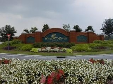 This lovely, large, wooded lot overlooks the 4th fairway and on Carolina National Golf Club in North Carolina - for sale on GolfHomes.com, golf home, golf lot