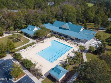 This lovely, large, wooded lot overlooks the 4th fairway and on Carolina National Golf Club in North Carolina - for sale on GolfHomes.com, golf home, golf lot