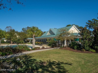 This lovely, large, wooded lot overlooks the 4th fairway and on Carolina National Golf Club in North Carolina - for sale on GolfHomes.com, golf home, golf lot