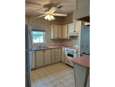 Double wide mobile home with 2 bedrooms, 2 Baths and 1040 sq ft on Orange Blossom Hills Golf and Country Club in Florida - for sale on GolfHomes.com, golf home, golf lot