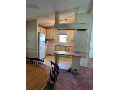 Double wide mobile home with 2 bedrooms, 2 Baths and 1040 sq ft on Orange Blossom Hills Golf and Country Club in Florida - for sale on GolfHomes.com, golf home, golf lot