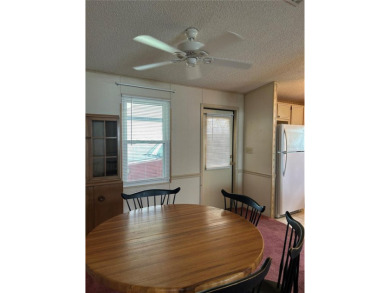 Double wide mobile home with 2 bedrooms, 2 Baths and 1040 sq ft on Orange Blossom Hills Golf and Country Club in Florida - for sale on GolfHomes.com, golf home, golf lot
