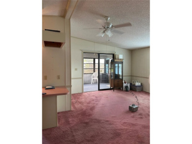 Double wide mobile home with 2 bedrooms, 2 Baths and 1040 sq ft on Orange Blossom Hills Golf and Country Club in Florida - for sale on GolfHomes.com, golf home, golf lot