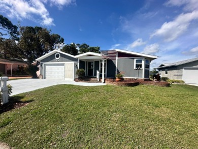 A beautiful 2 bedrooms, 2 bathrooms, Palm Harbor home located on on Del Tura Golf and Country Club in Florida - for sale on GolfHomes.com, golf home, golf lot
