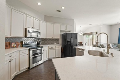 Beautifully designed one-story home offering 3 bedrooms, 2 on Woodbridge Golf Club in Texas - for sale on GolfHomes.com, golf home, golf lot