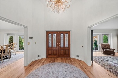 Stunning 1.5-story estate offering 4 bedrooms, 4.1 baths, a 2 on Country Club of Blue Springs in Missouri - for sale on GolfHomes.com, golf home, golf lot