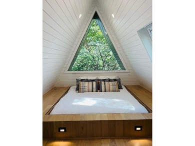 This one of a kind Scandanavian inspired A-frame offers a on Tanglewood Resort in Texas - for sale on GolfHomes.com, golf home, golf lot