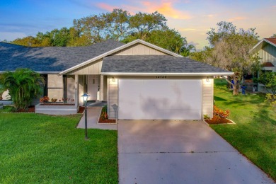 This spacious end unit in beautiful Eaglewood Country Club is on Eagle Wood Golf Course in Florida - for sale on GolfHomes.com, golf home, golf lot