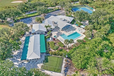 This spacious end unit in beautiful Eaglewood Country Club is on Eagle Wood Golf Course in Florida - for sale on GolfHomes.com, golf home, golf lot