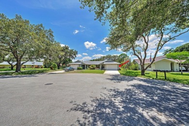 This spacious end unit in beautiful Eaglewood Country Club is on Eagle Wood Golf Course in Florida - for sale on GolfHomes.com, golf home, golf lot