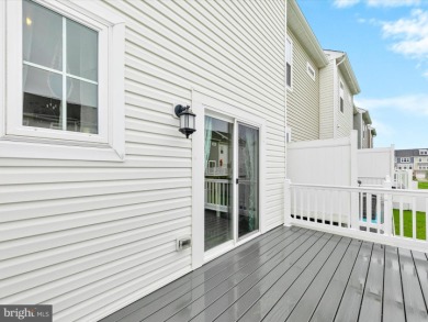Welcome to 35413 Wright Way, a beautiful three-story end-unit on Plantation Lakes Golf and Country Club in Delaware - for sale on GolfHomes.com, golf home, golf lot