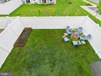 Welcome to 35413 Wright Way, a beautiful three-story end-unit on Plantation Lakes Golf and Country Club in Delaware - for sale on GolfHomes.com, golf home, golf lot