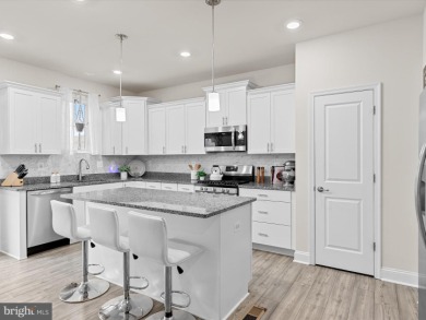 Welcome to 35413 Wright Way, a beautiful three-story end-unit on Plantation Lakes Golf and Country Club in Delaware - for sale on GolfHomes.com, golf home, golf lot