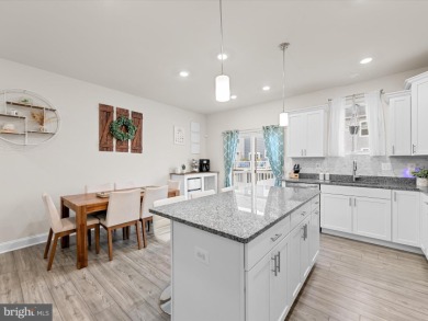 Welcome to 35413 Wright Way, a beautiful three-story end-unit on Plantation Lakes Golf and Country Club in Delaware - for sale on GolfHomes.com, golf home, golf lot