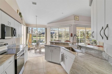 Indulge in unparalleled views of the tranquil lake and verdant on Calusa Lakes Golf Club in Florida - for sale on GolfHomes.com, golf home, golf lot