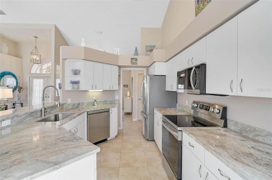 Indulge in unparalleled views of the tranquil lake and verdant on Calusa Lakes Golf Club in Florida - for sale on GolfHomes.com, golf home, golf lot