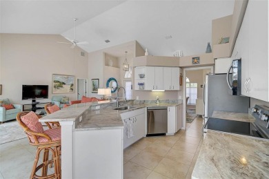 Indulge in unparalleled views of the tranquil lake and verdant on Calusa Lakes Golf Club in Florida - for sale on GolfHomes.com, golf home, golf lot