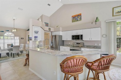 Indulge in unparalleled views of the tranquil lake and verdant on Calusa Lakes Golf Club in Florida - for sale on GolfHomes.com, golf home, golf lot