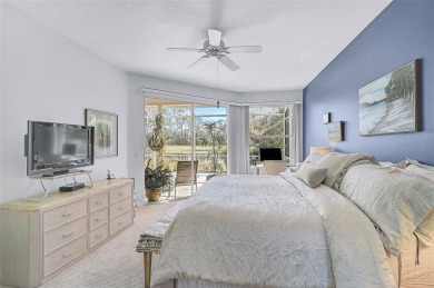 Indulge in unparalleled views of the tranquil lake and verdant on Calusa Lakes Golf Club in Florida - for sale on GolfHomes.com, golf home, golf lot