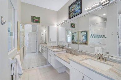 Indulge in unparalleled views of the tranquil lake and verdant on Calusa Lakes Golf Club in Florida - for sale on GolfHomes.com, golf home, golf lot
