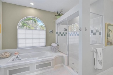 Indulge in unparalleled views of the tranquil lake and verdant on Calusa Lakes Golf Club in Florida - for sale on GolfHomes.com, golf home, golf lot