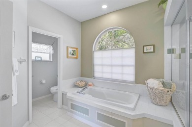 Indulge in unparalleled views of the tranquil lake and verdant on Calusa Lakes Golf Club in Florida - for sale on GolfHomes.com, golf home, golf lot
