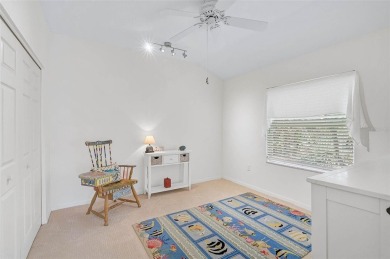Indulge in unparalleled views of the tranquil lake and verdant on Calusa Lakes Golf Club in Florida - for sale on GolfHomes.com, golf home, golf lot