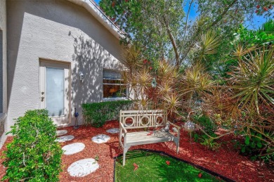 Indulge in unparalleled views of the tranquil lake and verdant on Calusa Lakes Golf Club in Florida - for sale on GolfHomes.com, golf home, golf lot