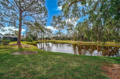 Indulge in unparalleled views of the tranquil lake and verdant on Calusa Lakes Golf Club in Florida - for sale on GolfHomes.com, golf home, golf lot
