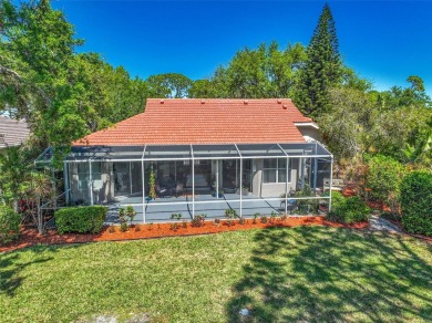 Indulge in unparalleled views of the tranquil lake and verdant on Calusa Lakes Golf Club in Florida - for sale on GolfHomes.com, golf home, golf lot