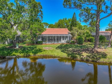 Indulge in unparalleled views of the tranquil lake and verdant on Calusa Lakes Golf Club in Florida - for sale on GolfHomes.com, golf home, golf lot