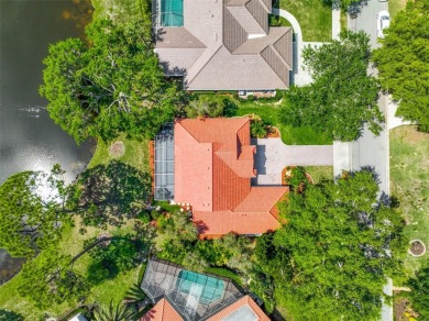 Indulge in unparalleled views of the tranquil lake and verdant on Calusa Lakes Golf Club in Florida - for sale on GolfHomes.com, golf home, golf lot