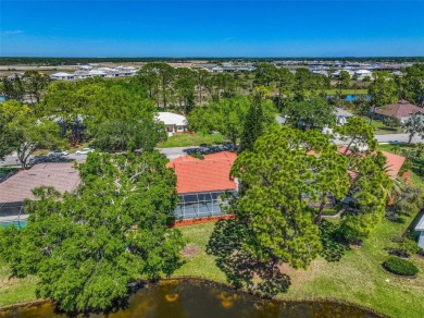 Indulge in unparalleled views of the tranquil lake and verdant on Calusa Lakes Golf Club in Florida - for sale on GolfHomes.com, golf home, golf lot