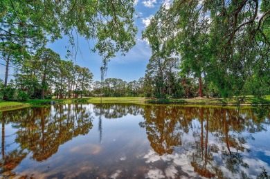 Indulge in unparalleled views of the tranquil lake and verdant on Calusa Lakes Golf Club in Florida - for sale on GolfHomes.com, golf home, golf lot