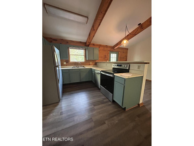 Discover your perfect escape in the heart of Townsend, Tennessee on Laurel Valley Golf Course in Tennessee - for sale on GolfHomes.com, golf home, golf lot