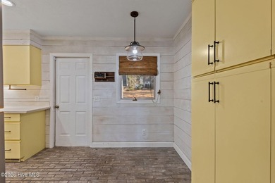 Welcome home to this beautiful lakefront property in Seven Lakes on Seven Lakes Country Club in North Carolina - for sale on GolfHomes.com, golf home, golf lot