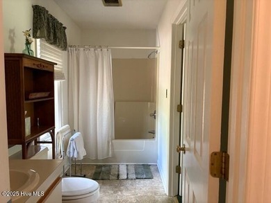 This two-bedroom townhome is located on the 12th hole of on Pinehurst  No. 6 Golf Course in North Carolina - for sale on GolfHomes.com, golf home, golf lot